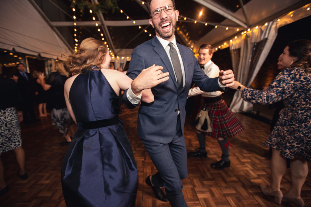 Photojournalistic wedding photography Scottish folk dancing