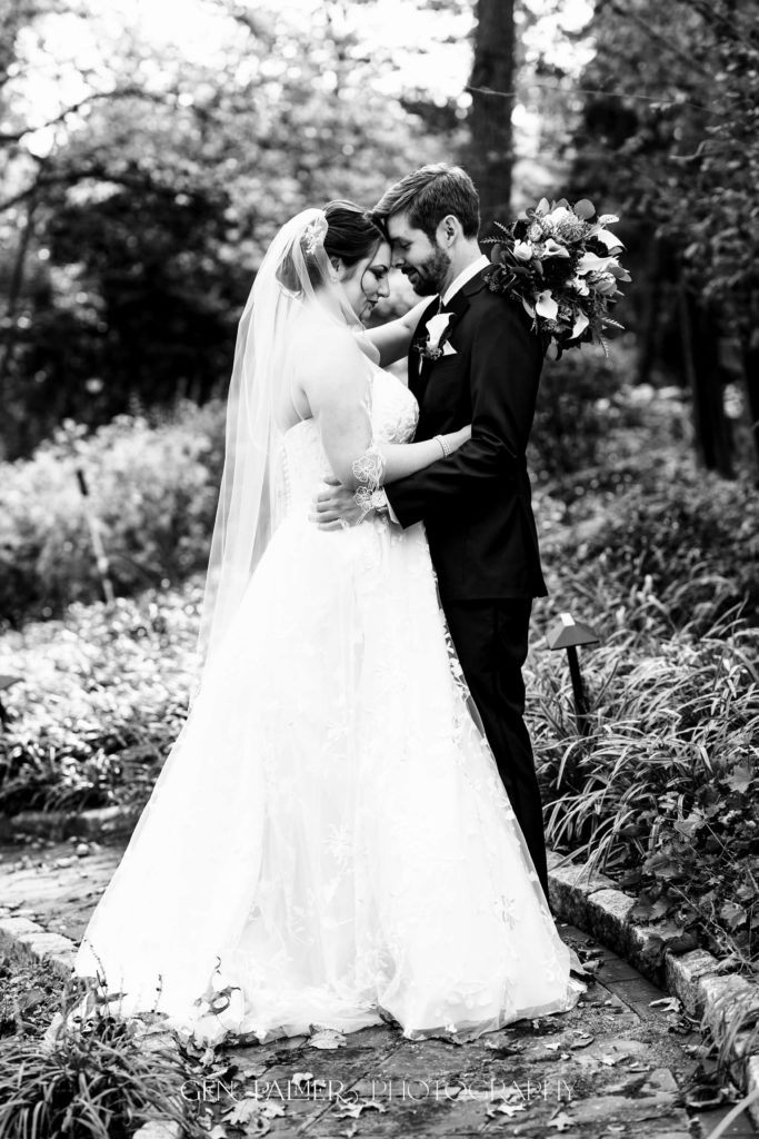 Romantic black and white portrait of bride and groom on wedding day