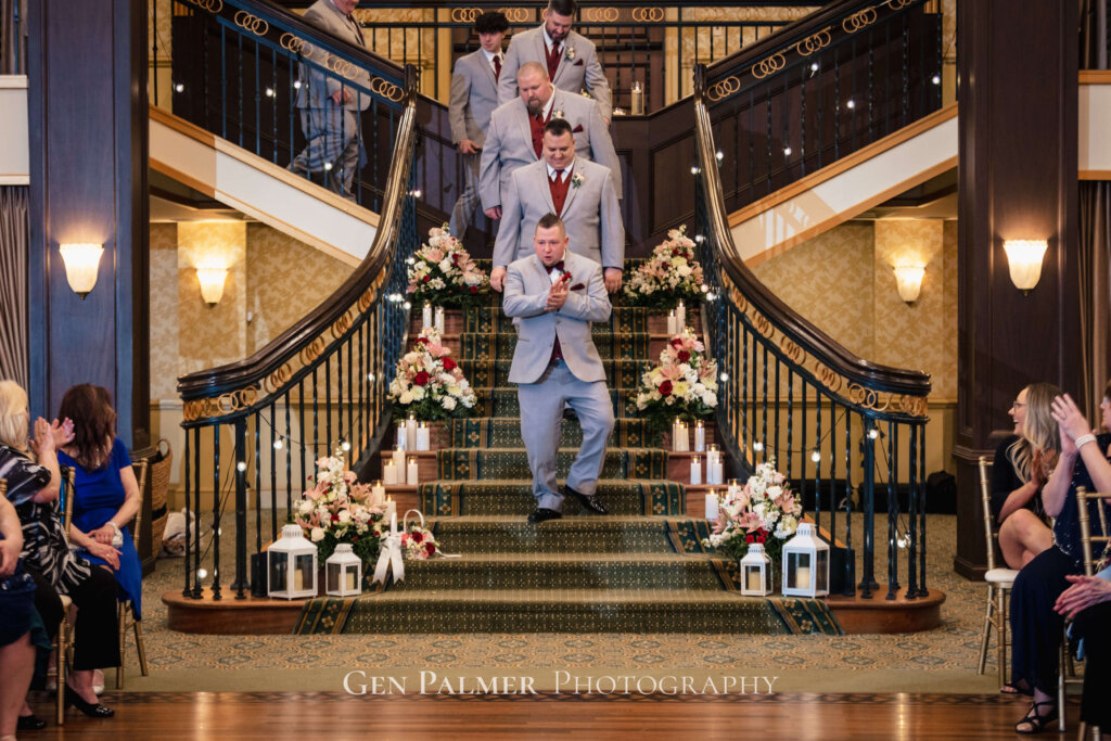 Groom and groomsmen going down by the staircase at Collingswood Grand Ballroom