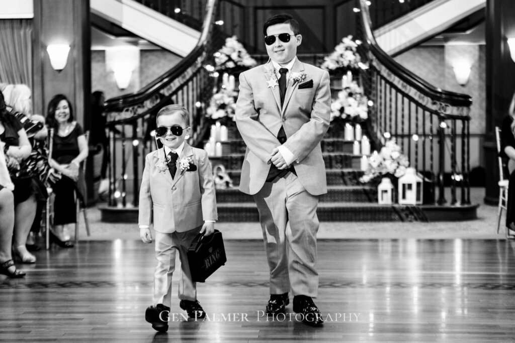 Ring bearers with shades entering the hall