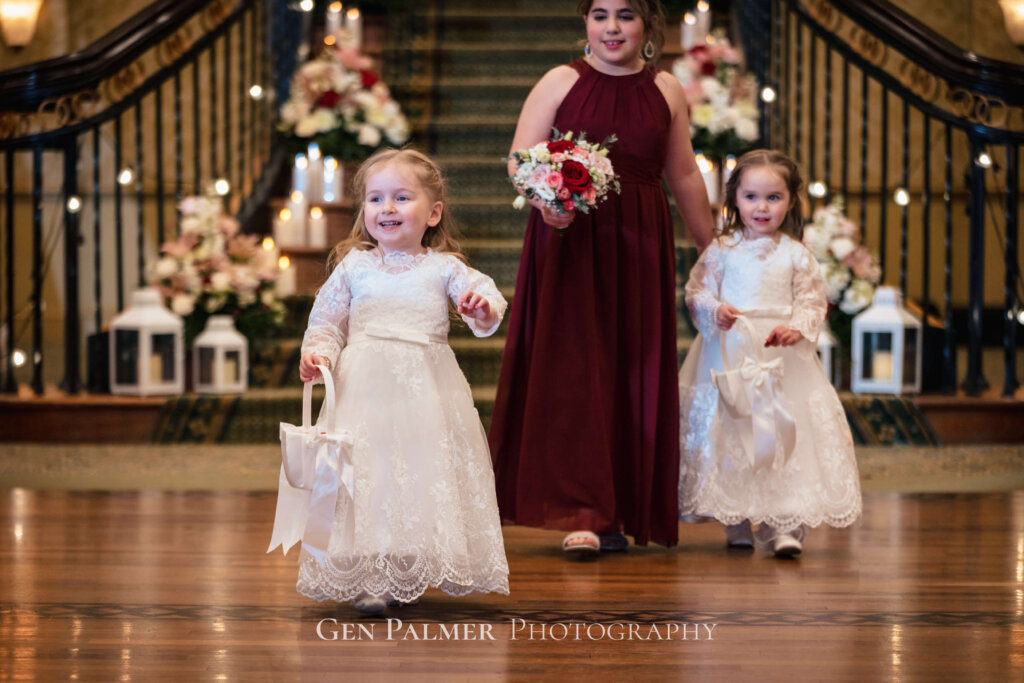 Cute flower girls entering the hall