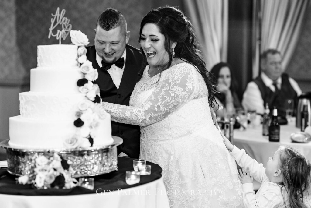 Cake cutting with the groom and bride
