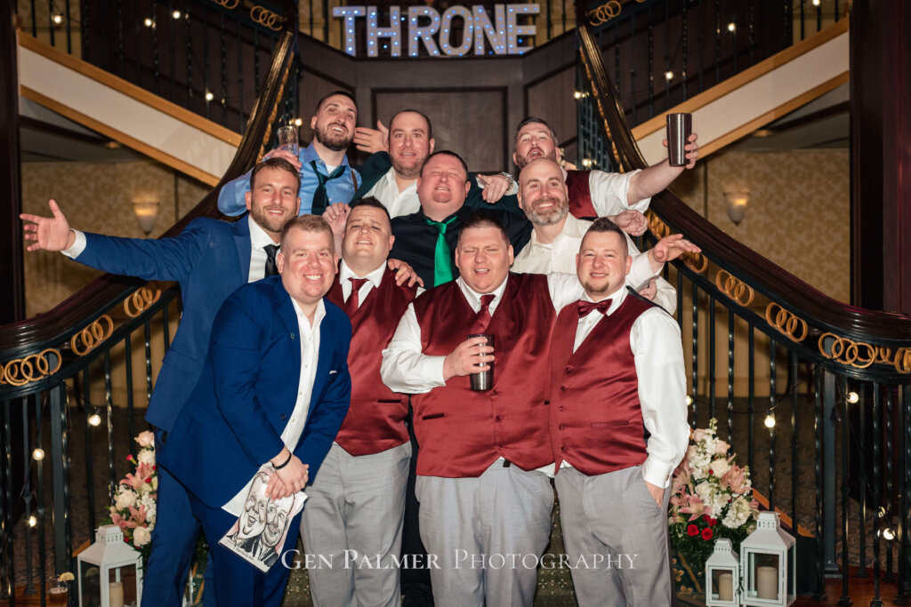The groom and the boys with drinks at the reception