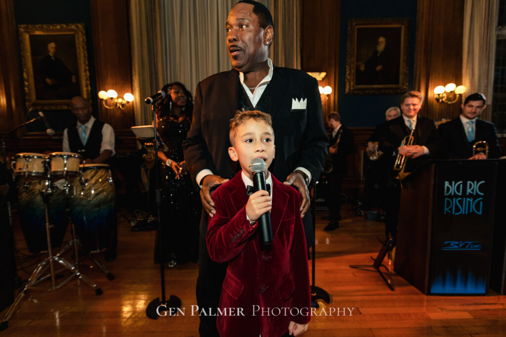 The little groomsman shares his singing talent at the reception