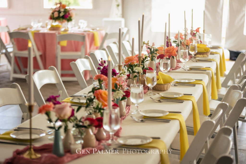 Summer Wedding at the Estate at Eagle Lake Reception with long tables and bright colors