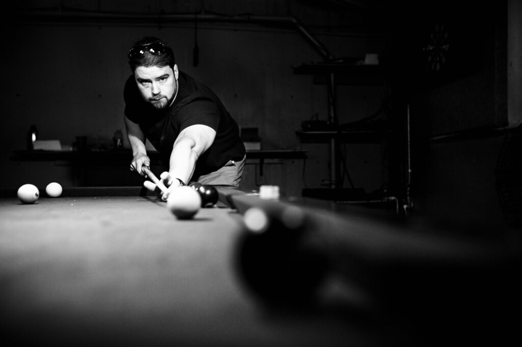 Create Your Stress-Free Wedding Timeline | Groom playing pool before his wedding