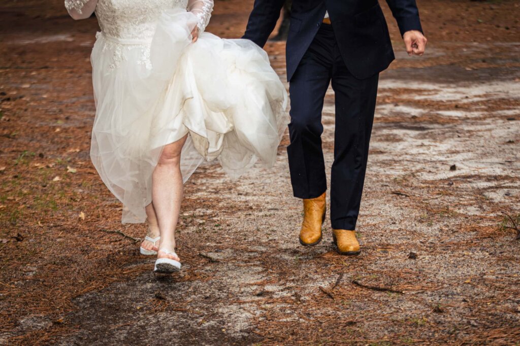 Create Your Stress-Free Wedding Timeline | Bride & Groom walking in the rain