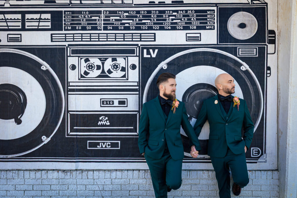 Wedding couple standing in front of boombox mural at Asbury Park.