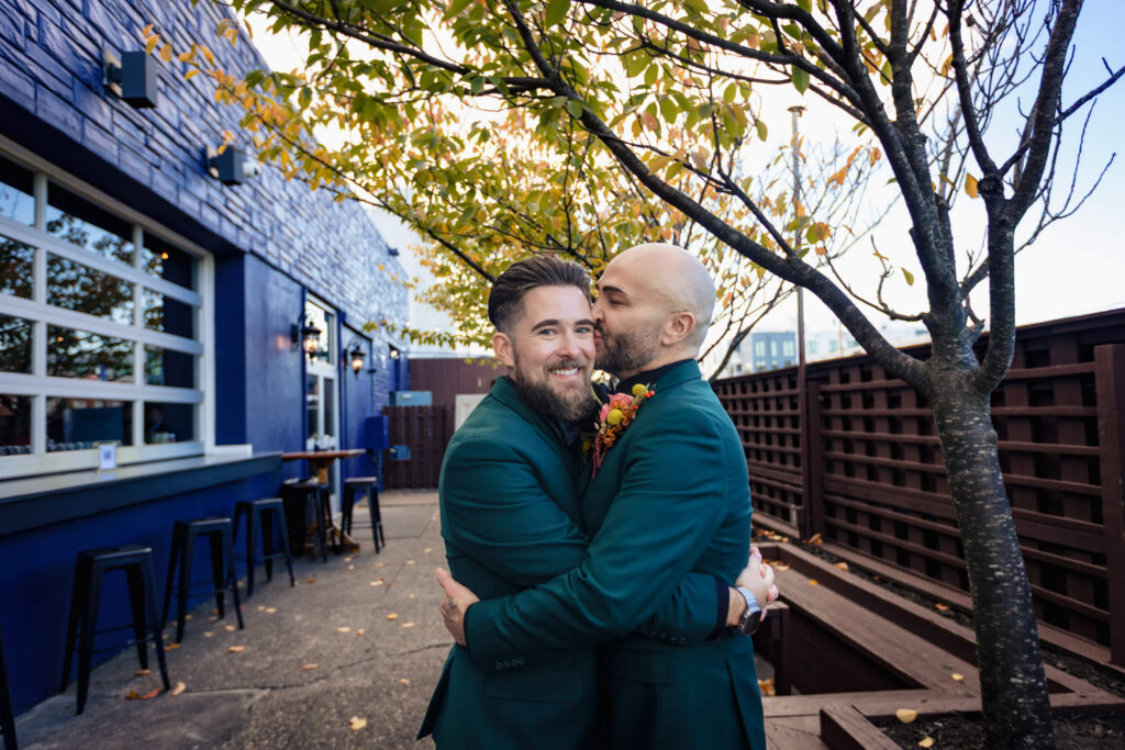 LGBTQ+ Wedding Couple hugging in Asbury Park