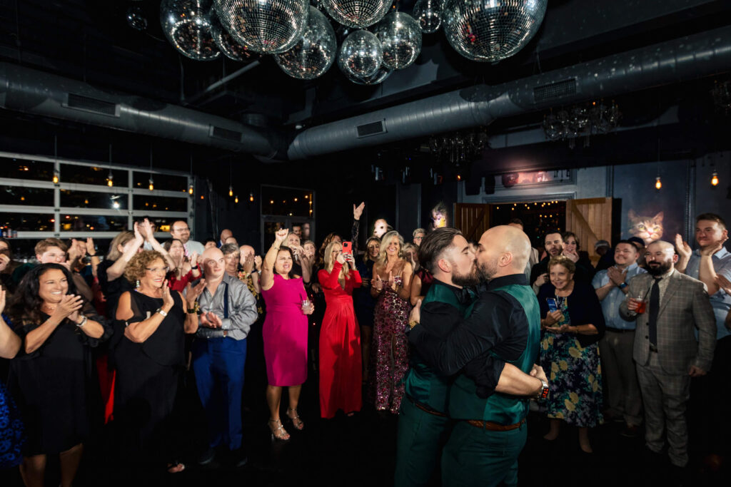 LGBTQ+ Wedding couple kissing at Porta Asbury Park