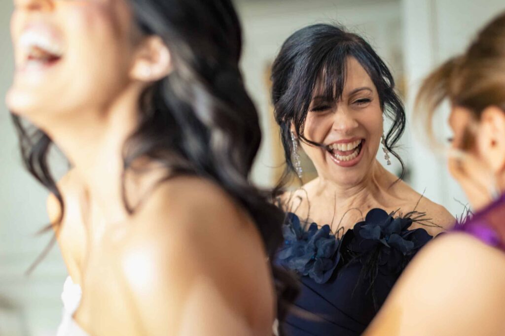 Bride and bridesmaids laughing together