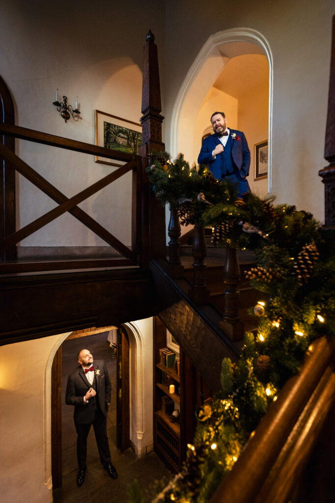 LGBTQ+ couple standing on different floors of Aldie Mansion