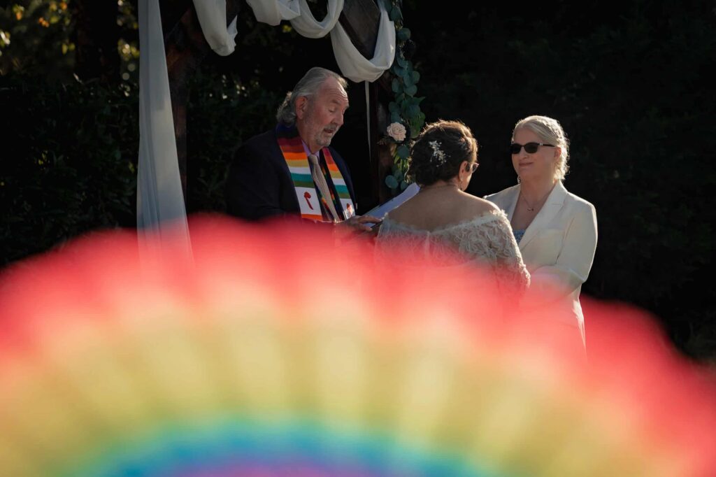 LGBTQ+ couple getting officiated