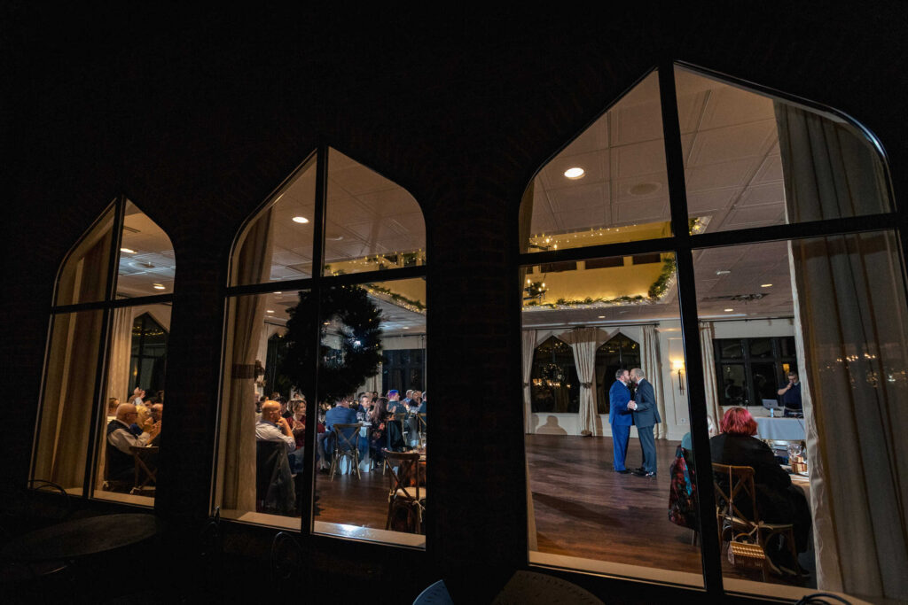 LGBTQ+ couple kissing during first dance
