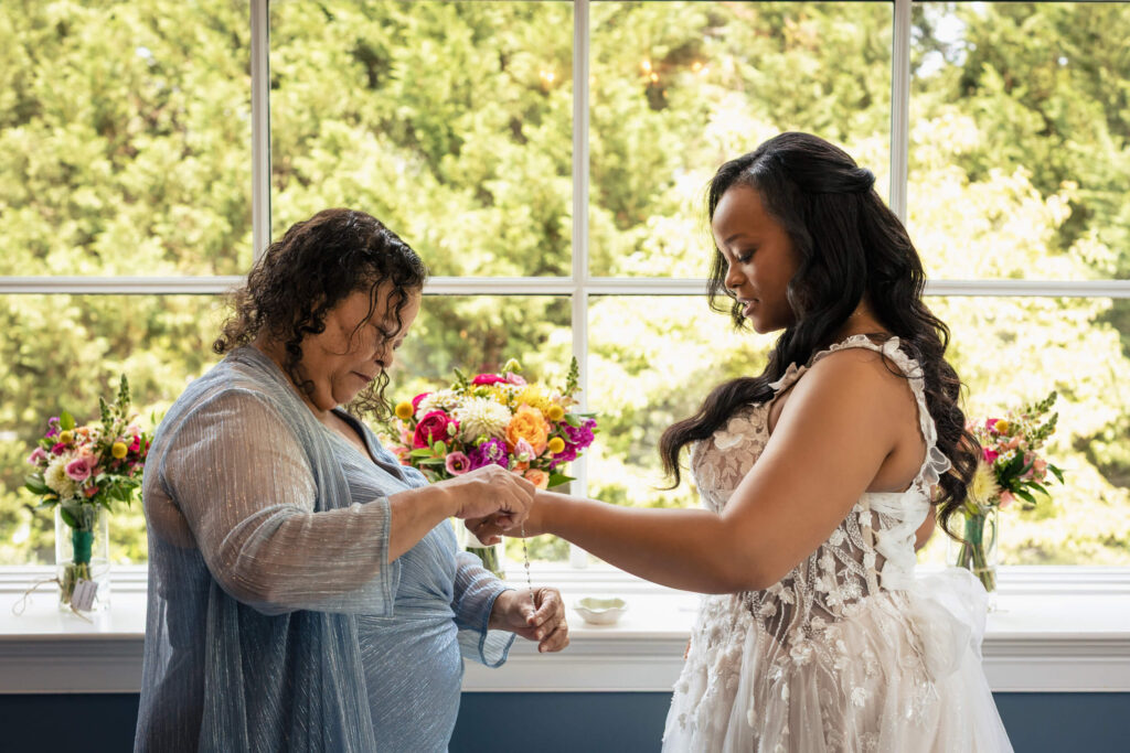 Mother helping daughter with wedding at Bradford Estate