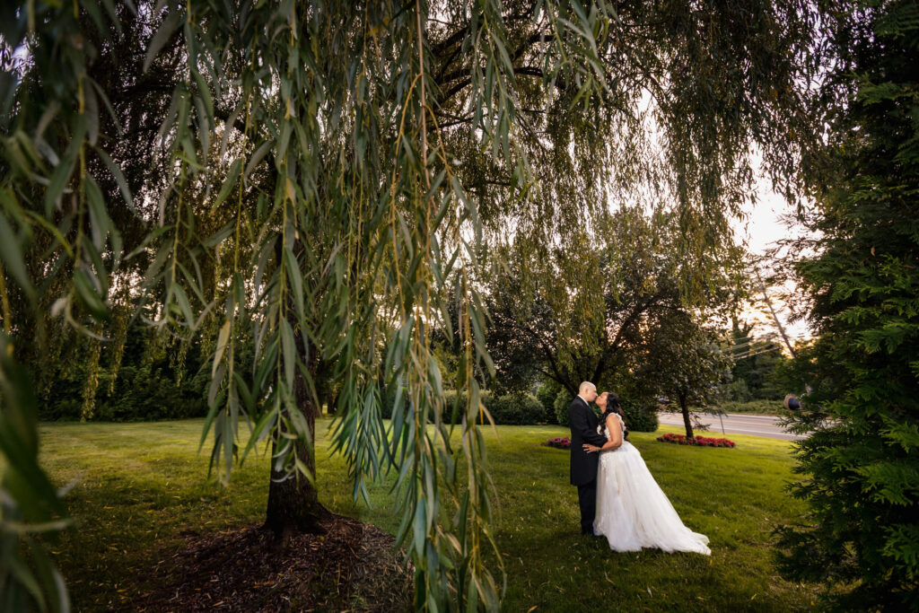 Wedding couple kissing at Bradford Estate